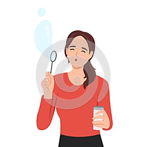 Having fun, summer, leisure concept. Positive young pretty girl standing playing with air bubbles blowing air bubble toy like