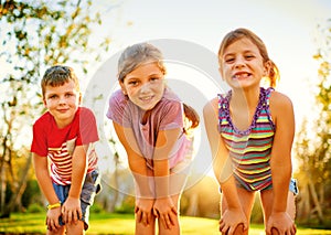 Having fun in the sun. Portrait of a group of little children playing together outdoors.