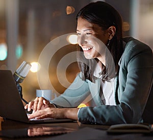 Having a great time on the grind. an attractive young businesswoman working late at her company offices.