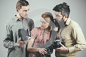 Having some problems. Group of photographers with retro cameras. Retro style woman and men hold analog photo cameras