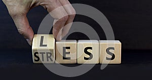 Having less stress or being stress-less symbol. Doctor turns a wooden cube and changes the concept word Stress to Less. Beautiful