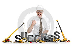 Having success: Businessman building success-word.