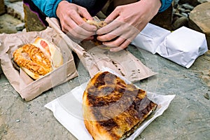 Having traditional Slovenian breakfast outdoor at natural rock table