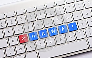 HAWAI writing on white keyboard with a aircraft sketch