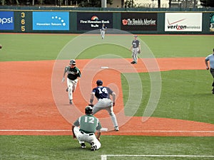 Hawaii Baseball player head to third base