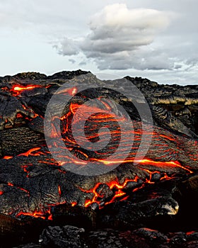 Hawaii - lava emerges from a column of the earth