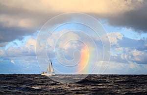 Hawaii Rainbow and sailboat view from the Ocean