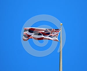 Hawaii State Flag against Blue Background