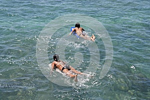 Hawaii Teenage girls paddling