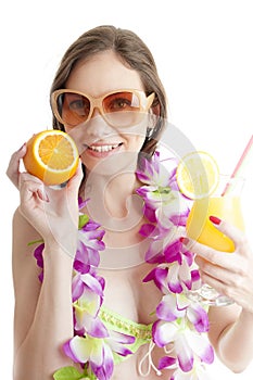 Hawaii woman in bikini wearing flower lei garland of pink orchid