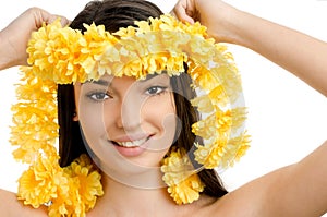 Hawaii woman showing a yellow flower lei garland.