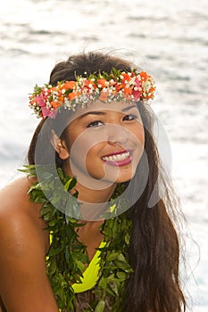 Hawaiian girl with flowers on lava