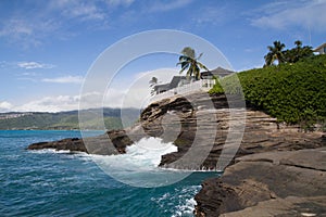 Hawaiian House on the rocky coast line