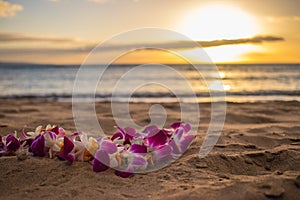 Hawaiian lei on the sand at the beach in Maui