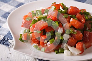 Hawaiian lomi lomi salad close-up on a plate. horizontal