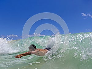 Hawaiian man bodysurfing