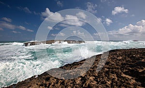 Hawaiian storm waves crashing into Laie Point coastline at Kaawa on the North Shore of Oahu Hawaii USA