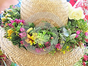 Hawaiian straw hats decorated with traditional flower leis