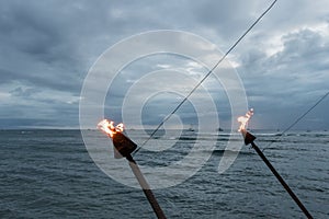 Hawaiian torches at sunset, Lahaina, Maui