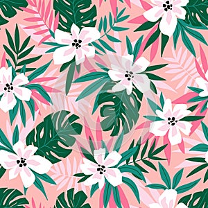 Hawaiian vector seamless pattern with pink flowers and green leaves. Stylish floral endless print for summer fabric design. photo