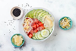 Hawaiian watermelon poke bowl with avocado, cucumber, mung bean sprouts and pickled ginger. Top view, overhead