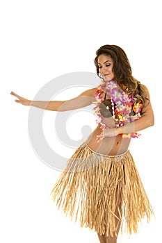 Hawaiian woman in grass skirt and coconut bra dancing