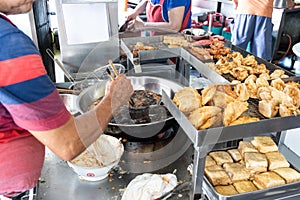 Hawker frying variety of delicious Penang lobak for sale photo