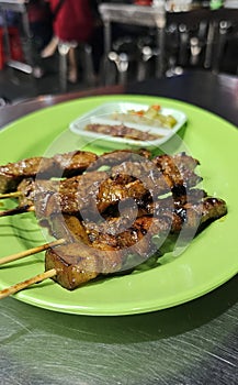 Hawkers food: Pork skewers marinated with sweet soy sauce photo