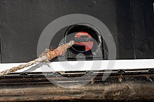 Hawsehole Mooring hole with ropes - Ship in a port