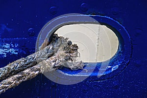 Hawser through a scupper hole on a ship