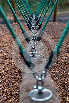 A hawser style horizontal rope swing at a childrens play park.