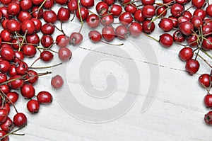 Hawthorn berries on wooden table