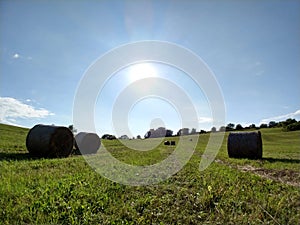 Hay bales on the meadow during autumn.