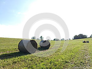 Hay bales on the meadow during autumn.