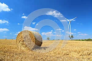 Hay bales and wind turbine