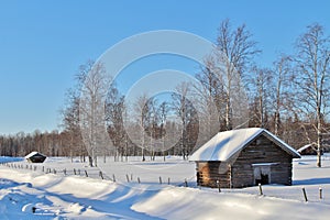 Hay barns in winter landscape