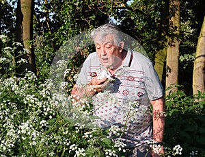 Hay fever sufferer sneezing. Allergic rhinitis photo