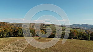 Hay harvest and green fields in the hills