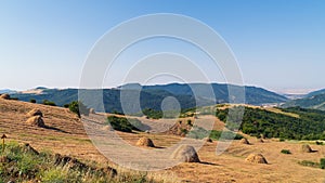 Hay stack on a hillside