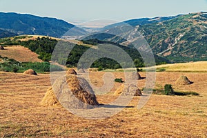 Hay stack on a hillside