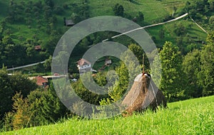 Hay stack on rural hillside