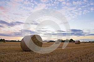 A haybale after the harvest at dusk time