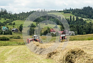 Haymaking in the countryside in the mountains