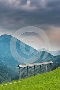 Hayrack on meadow in Slovenia mountains