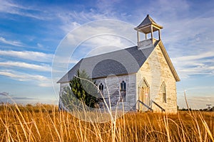 Hays, KS USA - Abandoned Wooden Church Building in a meadow of Hays, KS USA