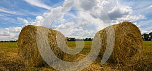 Haystack drying among wheat field after a harvest