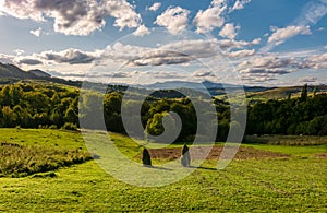 Haystack on fields in mountainous rural area