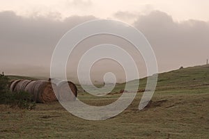 Haystack in fog dusk