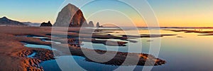 Haystack Rock at Cannon Beach, Oregon at sunset