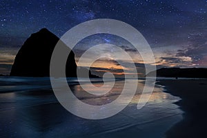 Haystack Rock under Starry Night Sky along Oregon coast